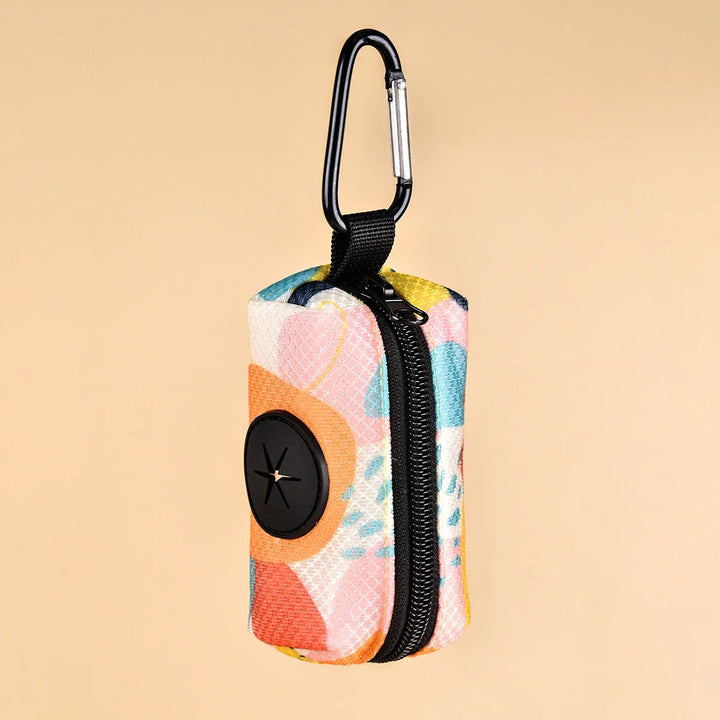 Multicolored Dog Poop Bag Holder with a carabiner on a beige background