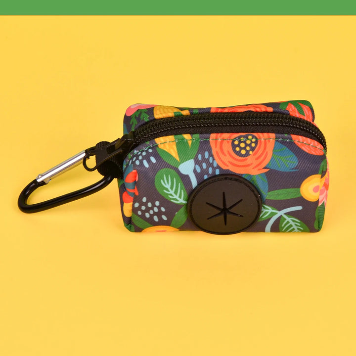 Floral-patterned Dog Poop Bag Holder with a carabiner on a yellow background