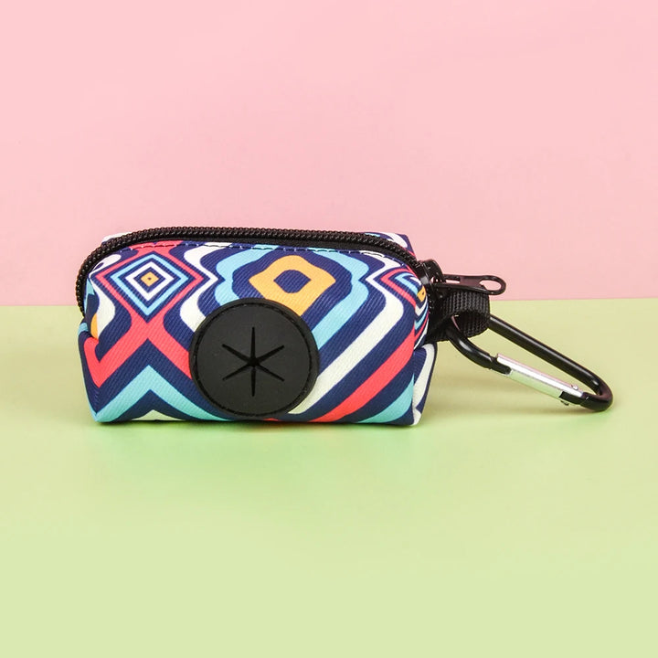 Multicolored geometric patterned Dog Poop Bag Holder with black carabiner on a gradient background