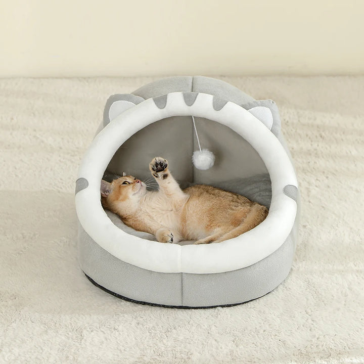 Cat playing in a gray Cat Bed Cave