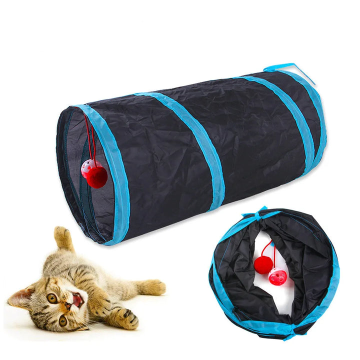 Black and blue cat tunnel toy with red balls, featuring a cat interacting with it on a white background.