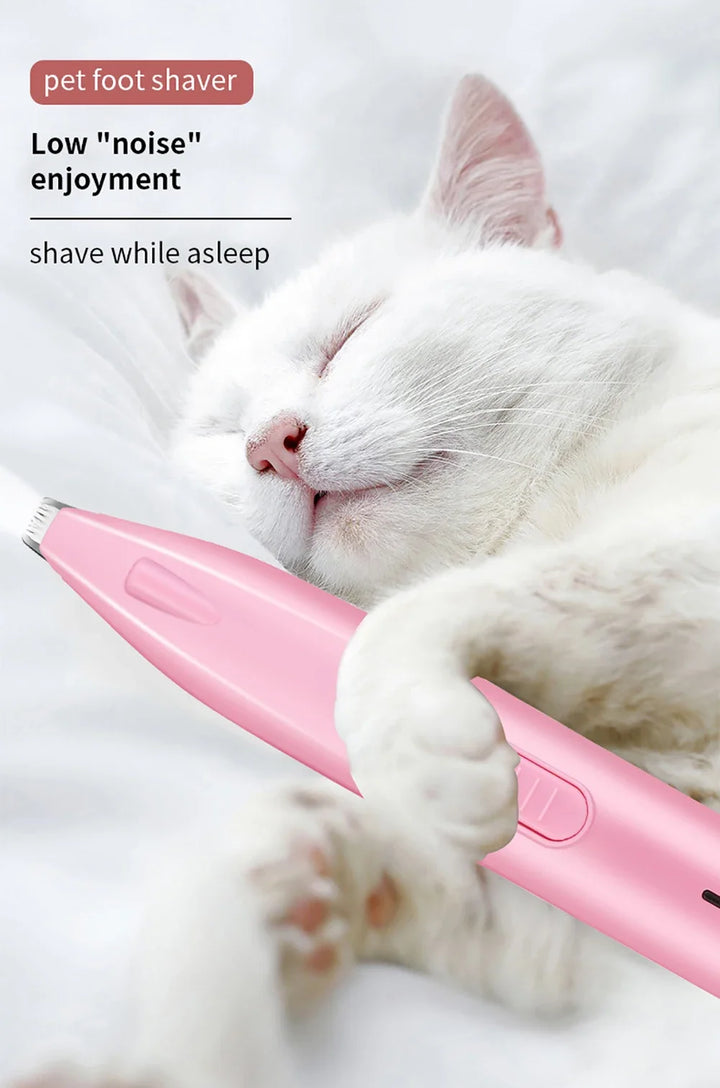 White cat holding a pink Led paw fur trimmer with low noise