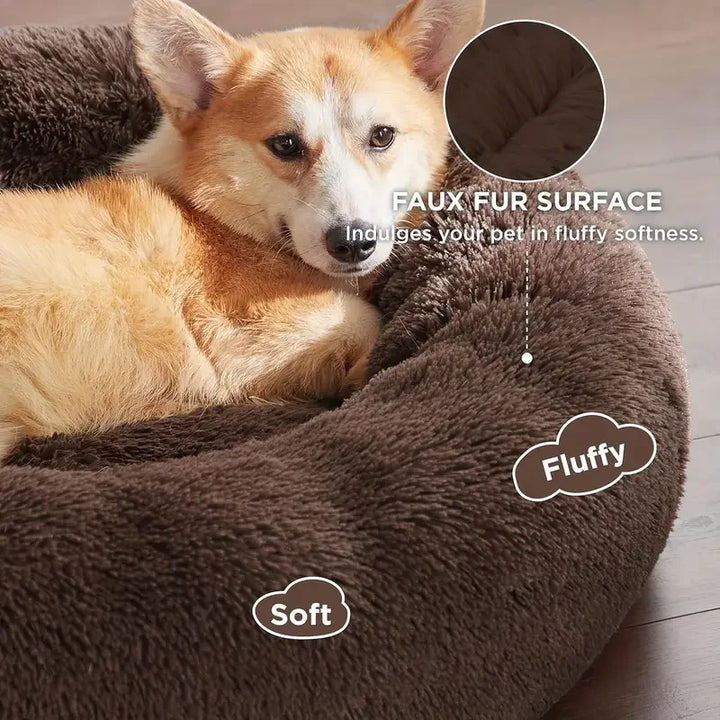 Dog lying on a fluffy brown Round Dog Bed with fur surface and softness.