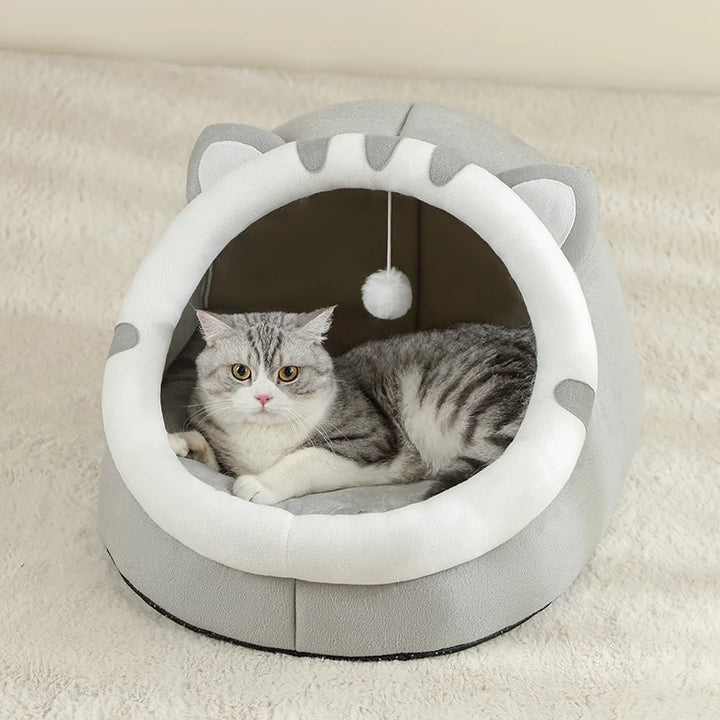 Cat lying in a gray and white Cat Bed Cave
