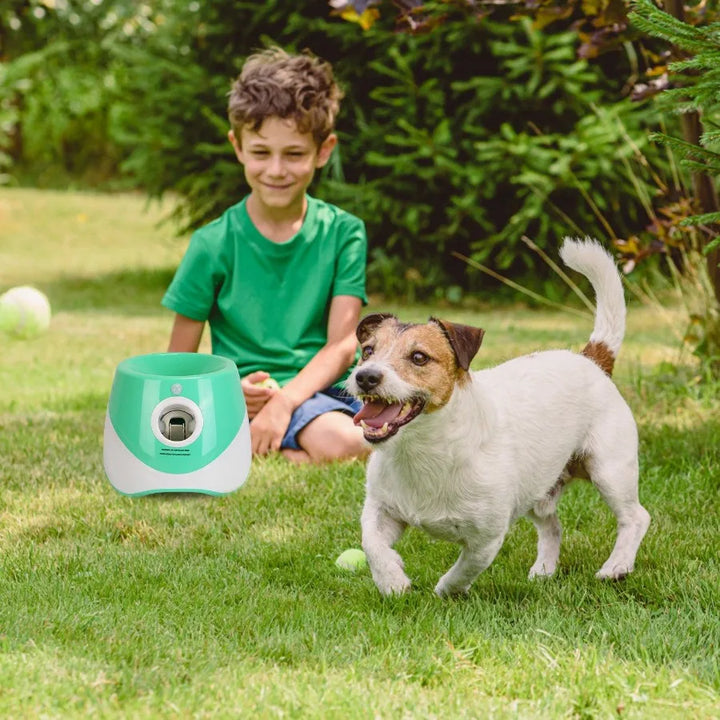 Kid playing with dog with an Automatic Dog Ball Launcher
