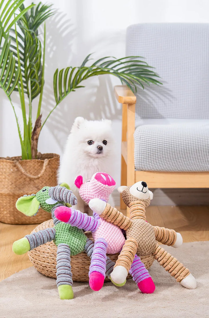 Dog with three indestructible squeaky dog chew toys