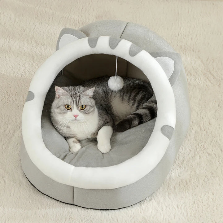 Cat lying in a gray and white Cat Bed Cave