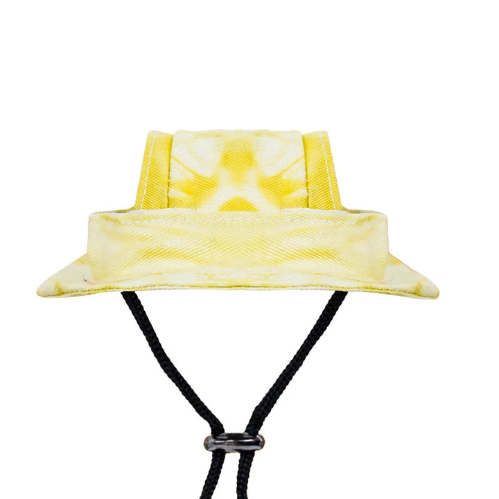 Yellow tie-dye dog bucket hat with a black cord on a white background