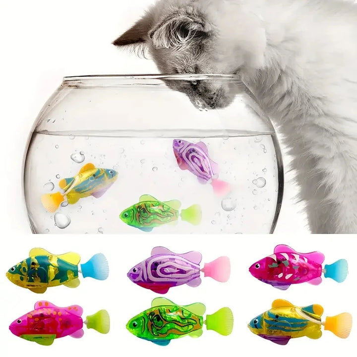 Cat playing with a clear fishbowl filled with colorful cat fish toys.
