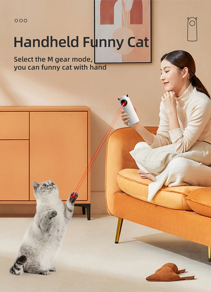 Person holding Automatic Cat laser toy
