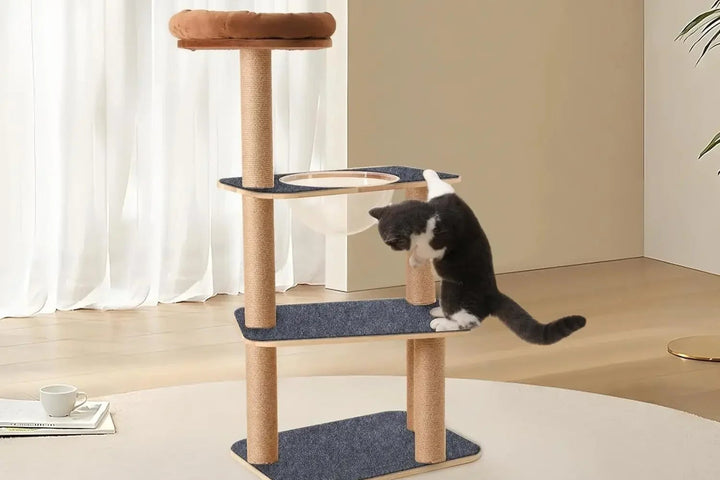 Cat playing on a multi-level cat tree with  Cat Scratching Mat attached to it
