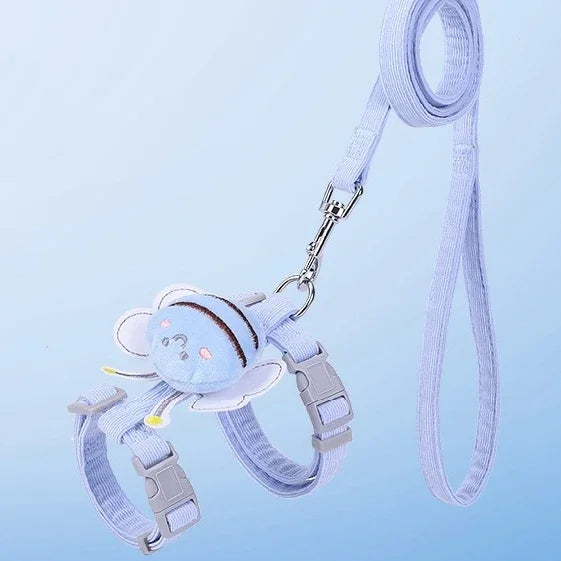 Blue leash and harness set with a cartoon bee design on a light blue background