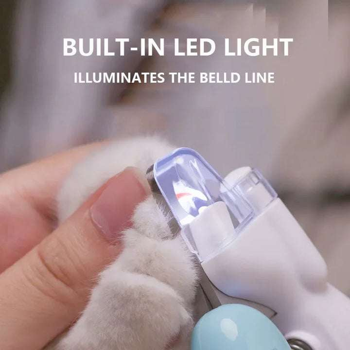 Pet nail clipper with built-in LED light on a paw