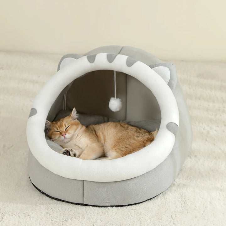 Cat sleeping in a gray Cat Bed Cave
