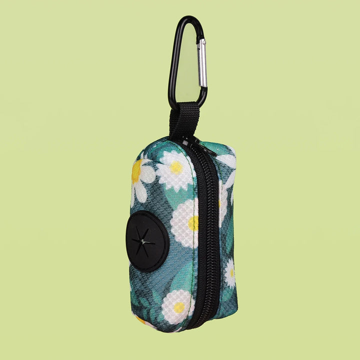 Floral-patterned Dog Poop Bag Holder with carabiner on a light green background