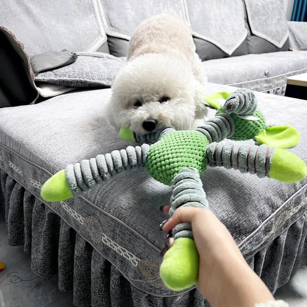 dog chewing an indestructible squeaky dog-chew toy