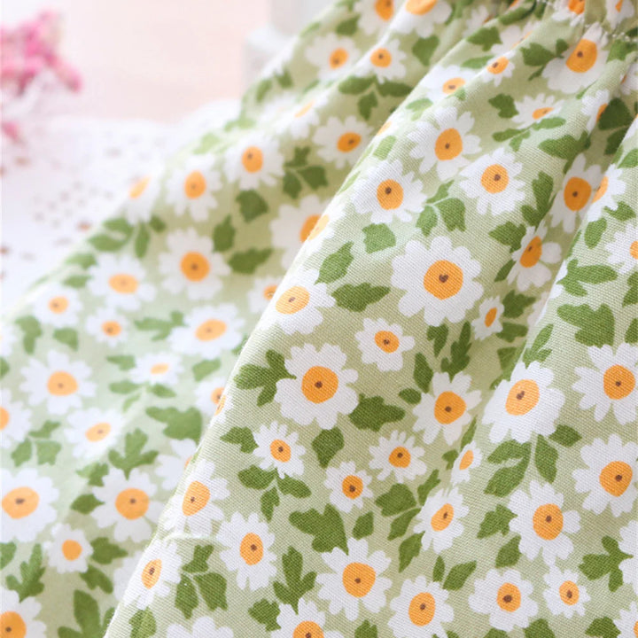 Close-up of a green floral cat dress