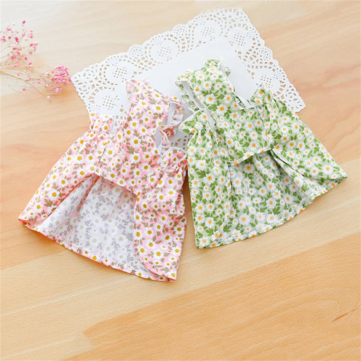 Two floral-patterned cat dresses