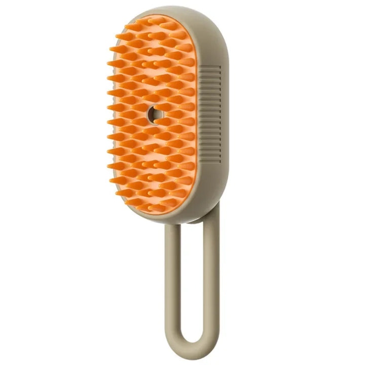 Pet grooming brush with orange bristles on a beige handle 
