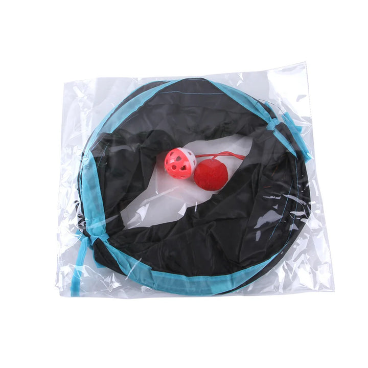 cat tunnel toy with a black and blue container and red balls inside, on a white background.