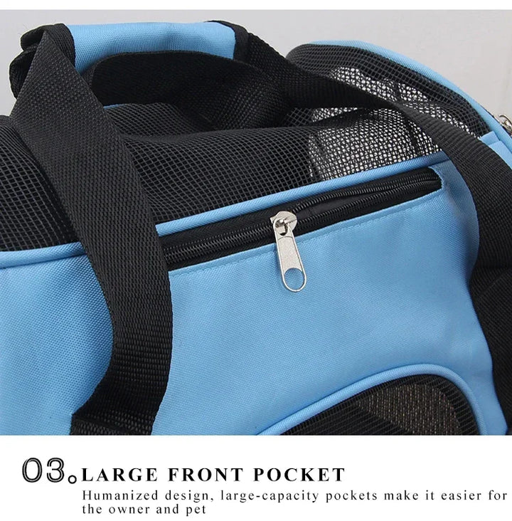 Blue pet carrier with black mesh and zipper, featuring a large front pocket.