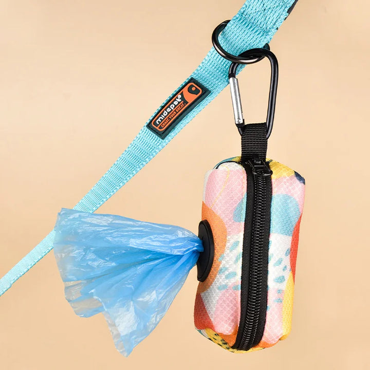 Multicolored Dog Poop Bag Holder  with a blue bag attached to a leash on a beige background